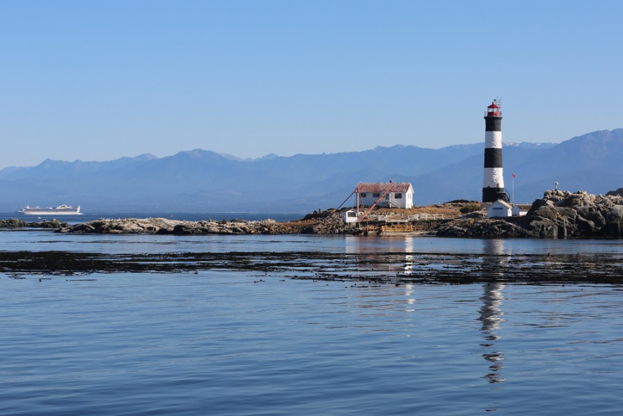 Cruise Ship Passes Lighthouse